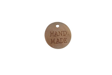Holzzierteil mit Schriftzug "handmade"
